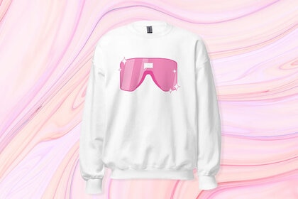 White Sweatshirt with pink sunglasses on it in front of a pink swirl background.