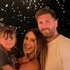Scheana Shay, Brock Davies, and Summer Moon posing together in front of lanterns floating into the sky in Las Vegas.