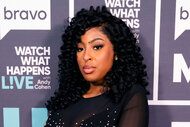 Lateasha Lunceford in front of a step and repeat at the Watch What Happens Live clubhouse in New York City.