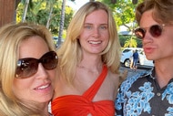Camille Grammer, Mason Grammer, and Jude Grammer posing together outdoors.
