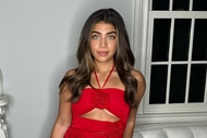 Gia Giudice wearing a red dress in her living room.