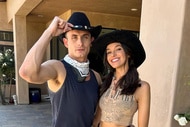 James Kennedy and Ally Lewber posing together in cowboy hats.