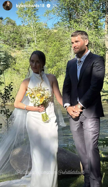 Whitney Davis in her wedding dress with Luke White her husband on their wedding day.