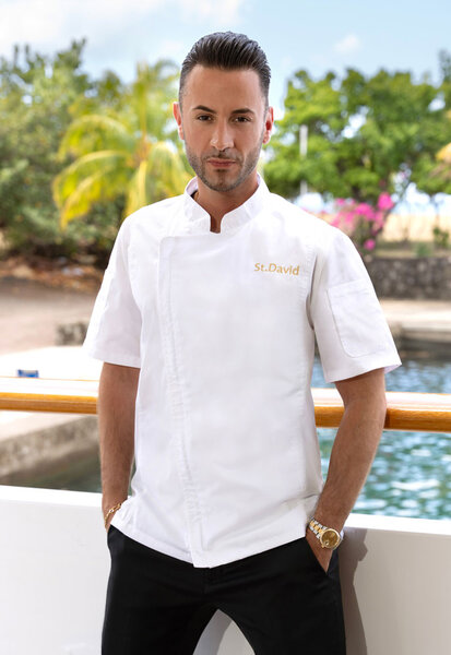 Chef Anthony Iracane of Below Deck Season 11 wearing his chef's uniform.