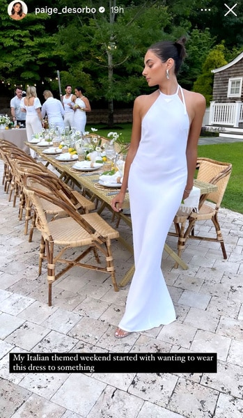 Full length of Paige Desorbo wearing a white gown at her Italian inspired dinner.