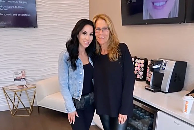 Rachel Fuda wearing a denim jacket while standing with her mom