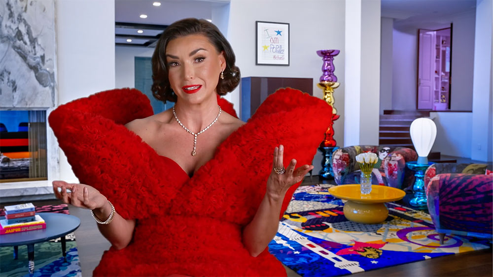 Bronwyn Newport talking while in a red gown.