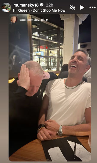 Mauricio Umansky and Paul PK Kemsley laughing together at a restaurant.