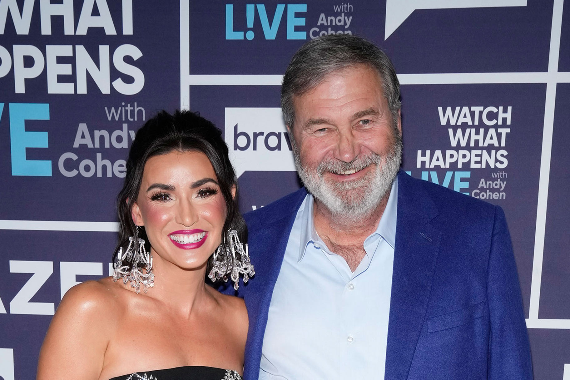 Bronwyn Newport and Todd Newport smiling together at the Watch What Happens Live clubhouse in New York City.