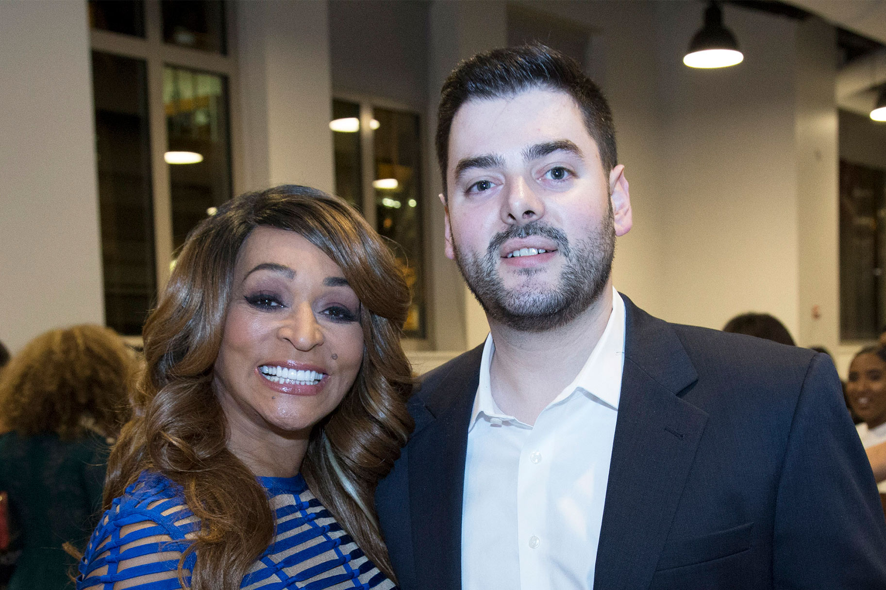 Karen Huger and Matthew Byars posing together at an event.