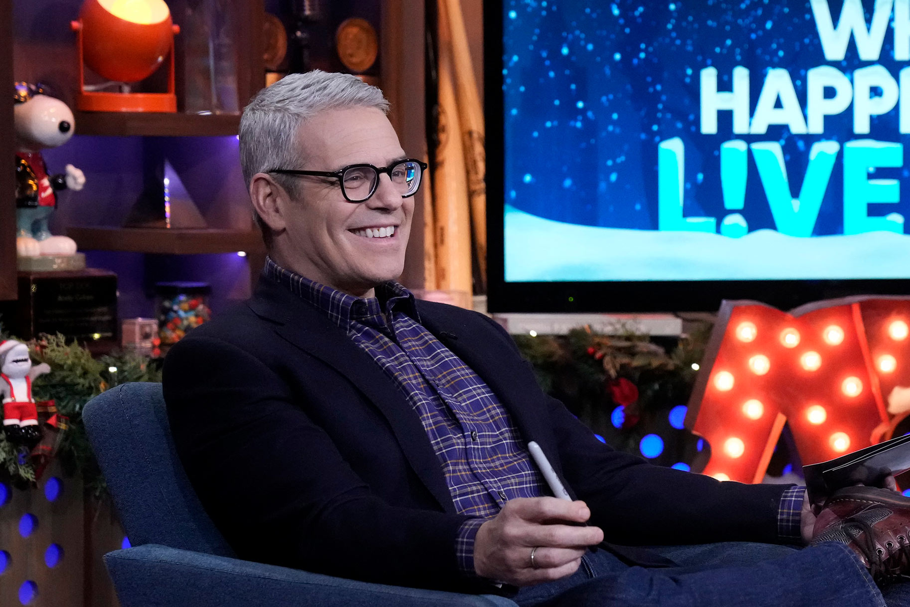 Andy Cohen wearing glasses at the Watch What Happens Live clubhouse in New York City.