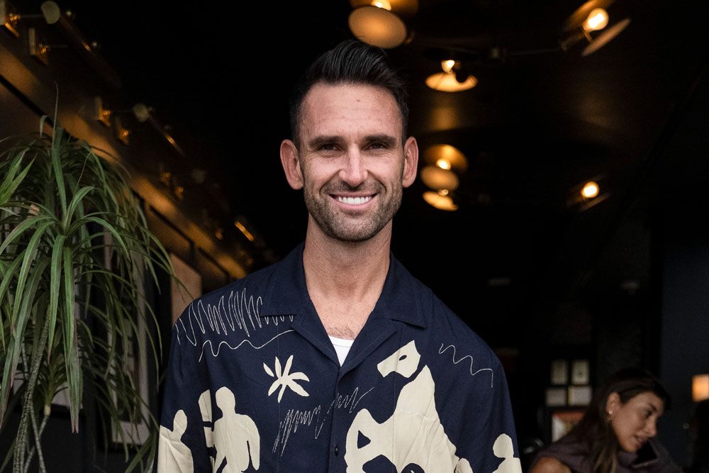 Carl Radke weraing a graphic pattern shirt at an event in NYC