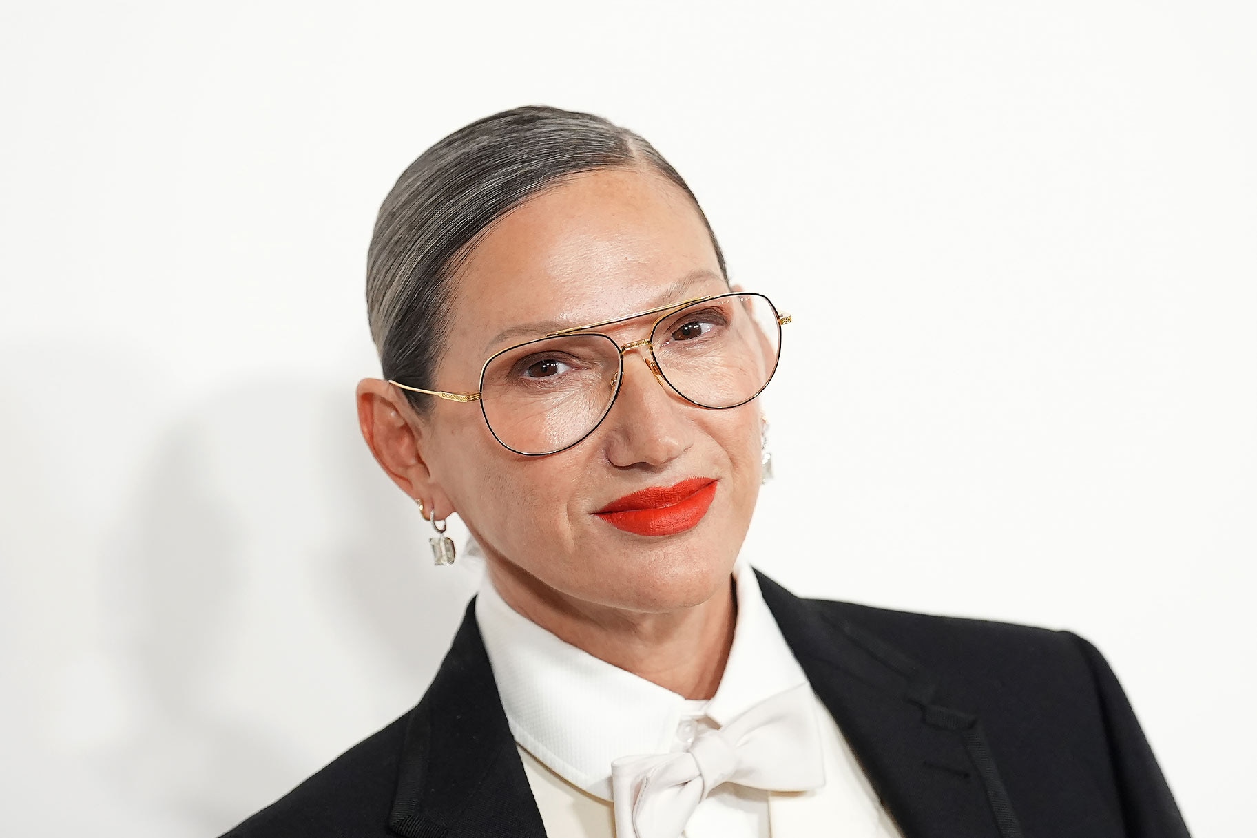 Jenna Lyons smiling in front of a step and repeat.