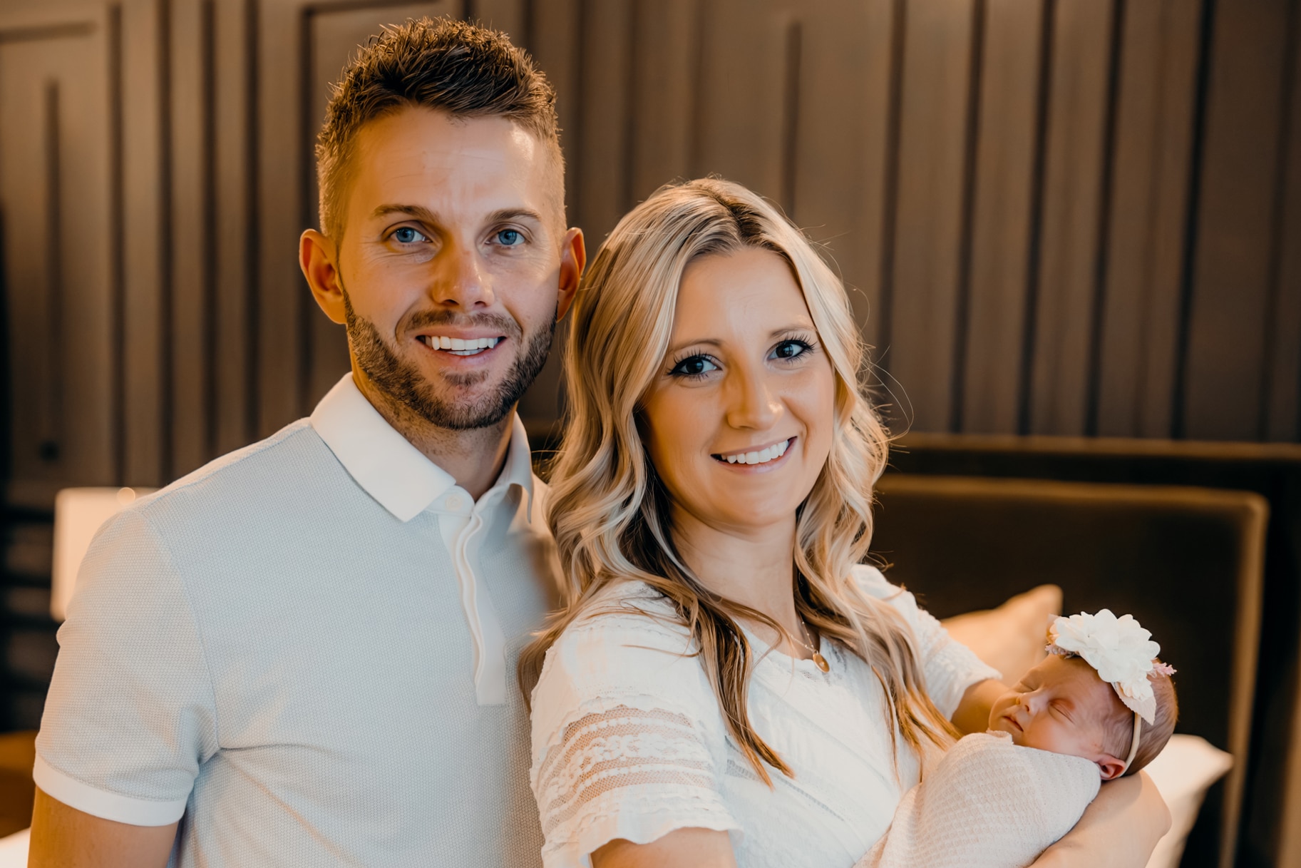 Kenny Sperry with his wife jessica Sperry holding their newborn daughter.