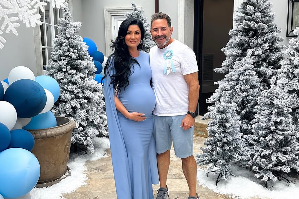 Brittany Pattakos and Paul Nassif together in front of trees and blue balloons