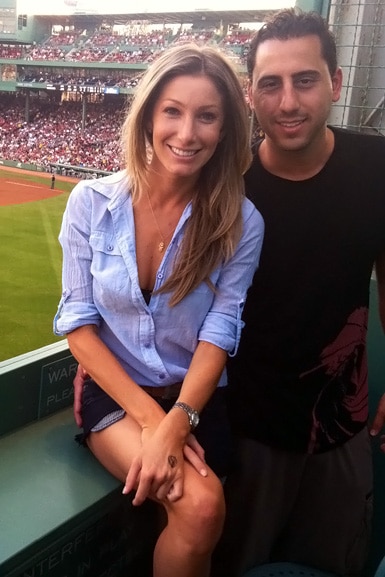 Heather Altman and Josh Altman in a box at the Boston Red Sox game