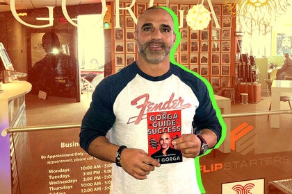 Joe Gorga with his book The Gorga Guide to Success