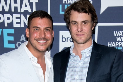 Jax Taylor and Shep Rose standing in front of the Watch What Happens Live step and repeat.