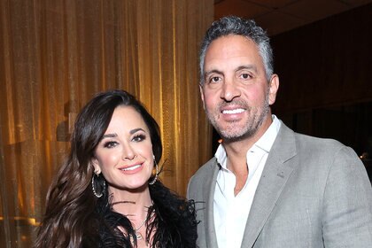 Kyle Richards and Mauricio Umansky posing together at an event.