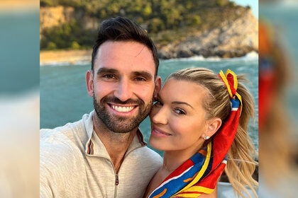 Photo of Carl Radke and Lindsay Hubbard at a beach