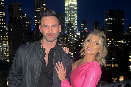 Carl Radke and Lindsay Hubbard in front of a city skyline