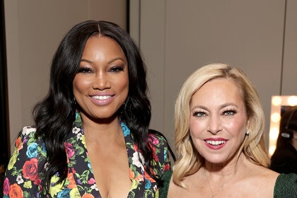 Garcelle Beauvais and Sutton Strack posing together durring Bravocon 2022