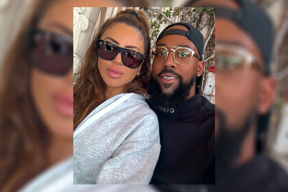 Larsa Pippen and Marcus Jordan pose for a photo together.