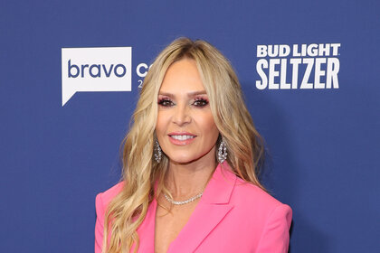 Tamra Judge wearing a pink suit on the red carpet for Bravocon 2022.