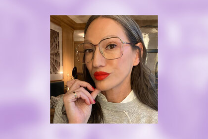 A photo of Jenna in wire frame glasses and bright red lipstick overlaid onto a colorful background.