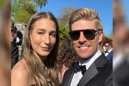 Amanda Batula and Kyle Cooke dressed in black tie for a friends wedding.