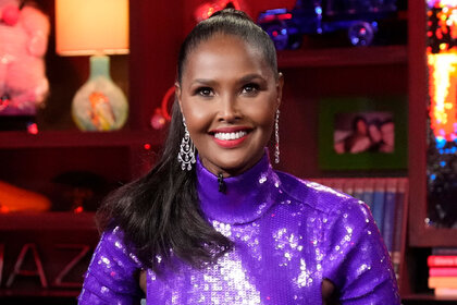 Ubah Hassan Wearing a purple dress while being a guest on WWHL.