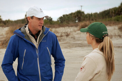 Shep Rose and Taylor Ann Green having a conversation on a beach in Charleston while filming Season 9 of Southern Charm.