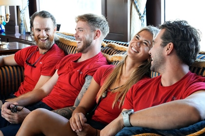 Iain Maclean, Nathan Gallagher, Gael Cameron, and Joe Brittany sitting together and laughing.