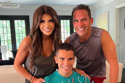 Teresa Giudice, Louie Ruelas, and Nicholas Ruelas posing together.