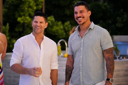 Danny Booko and Jax Taylor smiling next to each other outdoors.