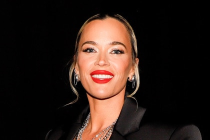 Teddi Mellencamp smiling in a black blazer.