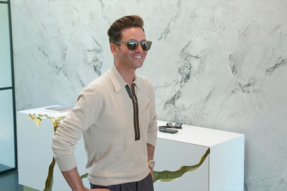 Josh Flagg standing in an entryway smiling.