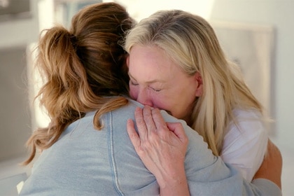 Shannon Beador crying while hugging Emily Simpson.