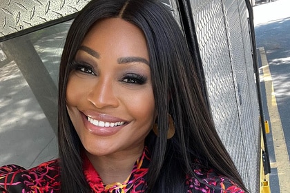 Cynthia Bailey smiling outdoors.