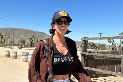 Katie Maloney smiling outdoors in the desert.