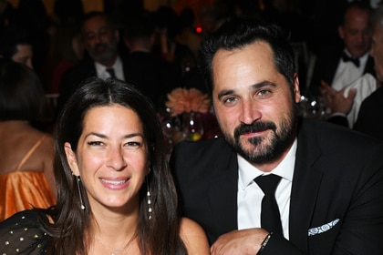 Rebecca Minkoff and Gavin Bellour smiling together at a dining table.