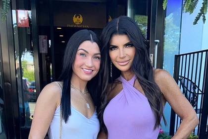 Teresa Giudice and Gabriella Giudice posing together outside of a restaurant.