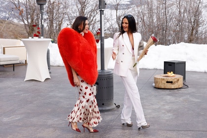 Bronwyn Newport and Lisa Barlow walking outdoors together.