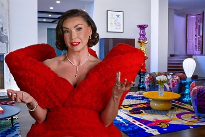 Bronwyn Newport talking while in a red gown.