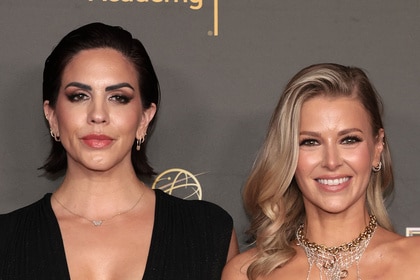 Ariana Madix and Katie Maloney posing in front of a step and repeat at the Creative Arts Emmys.