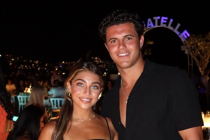 Gia Giudice and Christian Carmichael smiling together.