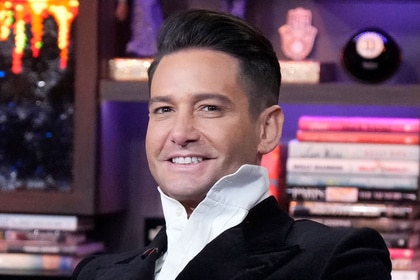 Josh Flagg smiling at the Watch What Happens Live clubhouse in New York City.