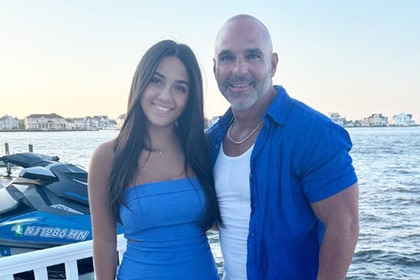 Antonia Gorga wears a blue strapless dress with her dad Joe Gorga on the water