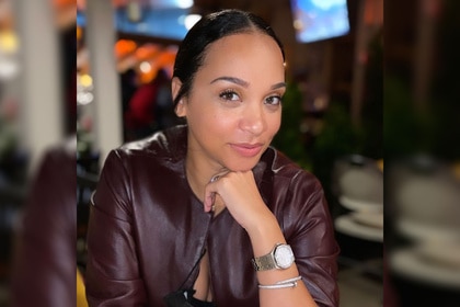 Dr Mirica Sanders wearing a burgundy jacket at a restaurant