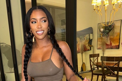 Porsha Williams wearing a brown tank top and and two braids